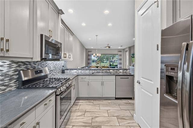 28405 Abruzzo Dr, Bonita Springs, FL 34135 See the big pantry?? Gas stove and large single sink present, too.