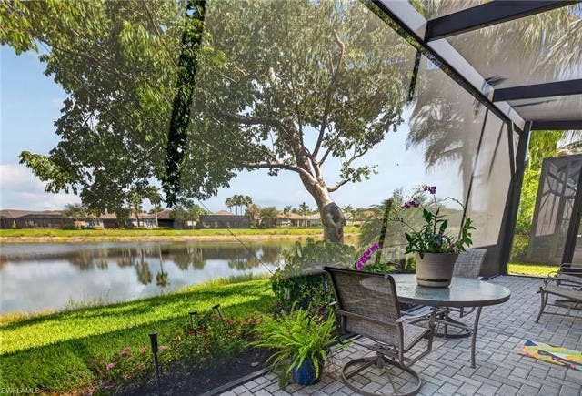 28405 Abruzzo Dr, Bonita Springs, FL 34135 THIS EXPANDED LAKEFRONT PATIO IS SCREENED THE ENTIRE WIDTH OF THE VILLA! Ahh! Enjoy!