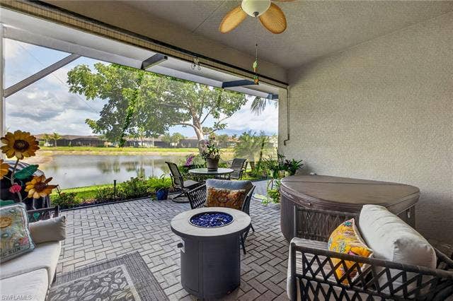 28405 Abruzzo Dr, Bonita Springs, FL 34135 LAKEFRONT views to enjoy 24/7! Tree outside cage provides some privacy.