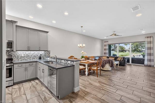 28405 Abruzzo Dr, Bonita Springs, FL 34135 BEAUTIFUL, upgraded backsplash present here. Don't you love it? Soft close cabinetry, too!
