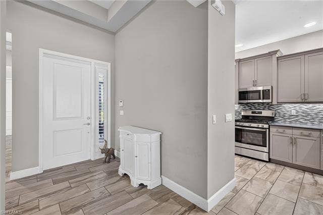 28405 Abruzzo Dr, Bonita Springs, FL 34135 This stunning, upgraded plank tile is throughout this home!!!