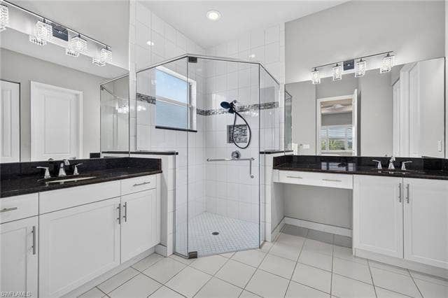 28405 Abruzzo Dr, Bonita Springs, FL 34135 Seamless shower door, floor to ceiling tile and corner seat in shower, upgraded lighting, too! Vanity area and dual sinks. Grab bar present in shower. Lots of storage!