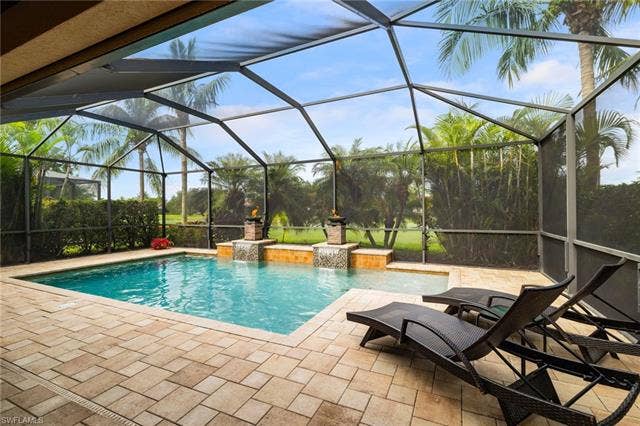28522 Westmeath Ct, Bonita Springs, FL 34135 Custom Pool with Sun shelf and Fire Bowls.