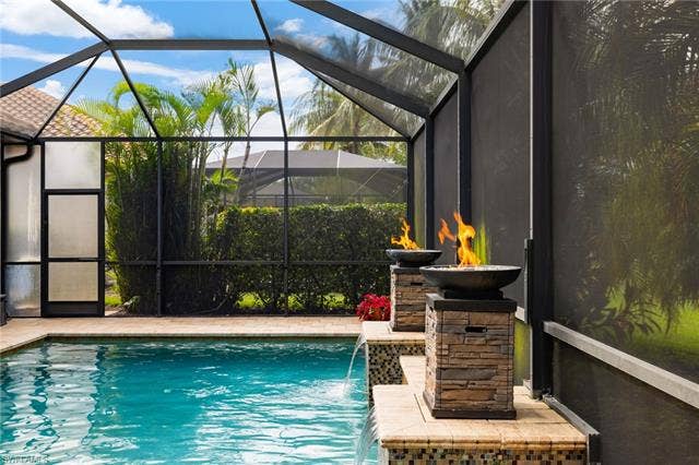 28522 Westmeath Ct, Bonita Springs, FL 34135 Custom Pool with Sun shelf and Fire Bowls.