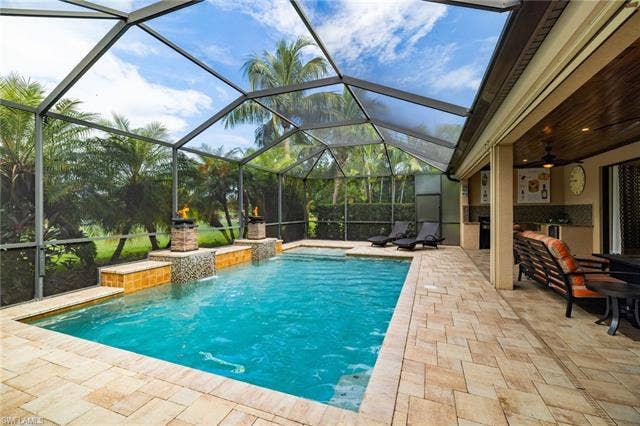 28522 Westmeath Ct, Bonita Springs, FL 34135 Custom Pool with Sun shelf and Fire Bowls.