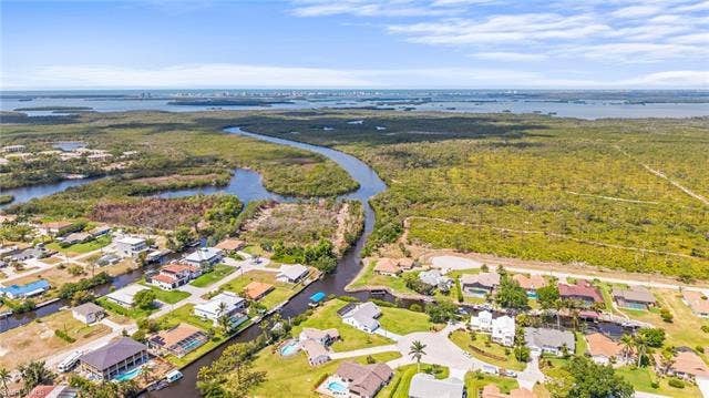 20640 Porthole Ct, Estero, FL 33928 Bird's eye view featuring a water view and a residential view