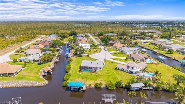 20640 Porthole Ct, Estero, FL 33928 Bird's eye view featuring a residential view, a view of trees, and a water view