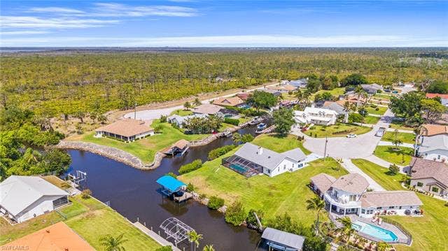 20640 Porthole Ct, Estero, FL 33928 Aerial view with a forest view, a water view, and a residential view