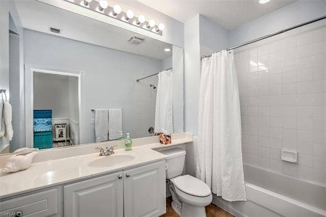 15059 Blue Marlin Ter, Bonita Springs, FL 34135 Hall BA Vanity with white cabinetry, integrated sink, and light-colored countertop