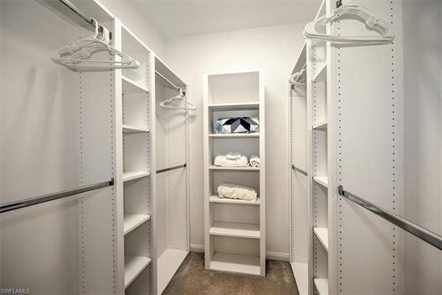 15059 Blue Marlin Ter, Bonita Springs, FL 34135 Ca. Custom closet organization system featuring white shelving units and metal hanging rods