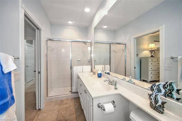 15059 Blue Marlin Ter, Bonita Springs, FL 34135 white cabinetry and Sep tub and shower other side upper main suite with balcony