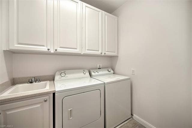 15059 Blue Marlin Ter, Bonita Springs, FL 34135 Laundry area featuring white cabinetry, a utility.& laundry Tub.sink, and a countertop