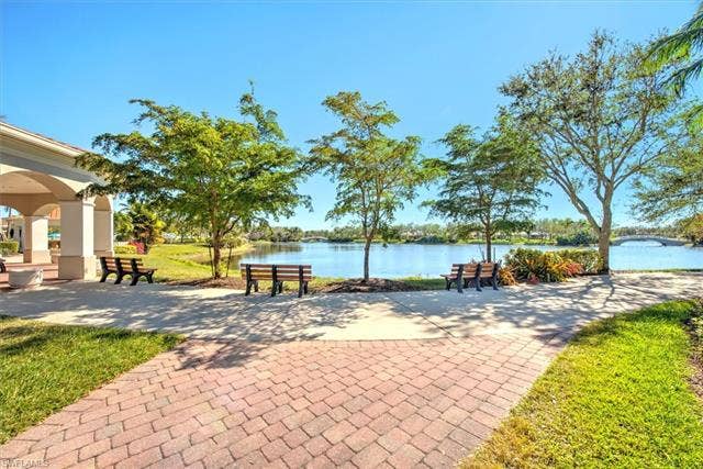 15059 Blue Marlin Ter, Bonita Springs, FL 34135 Paved walkway with brick details leading to a waterfront area