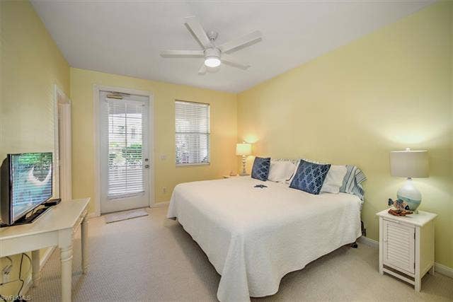15059 Blue Marlin Ter, Bonita Springs, FL 34135 Carpeted room with a vaulted ceiling and a ceiling fan with integrated lighting, walk in closet , covered balcony for your evening beverage .dinner .