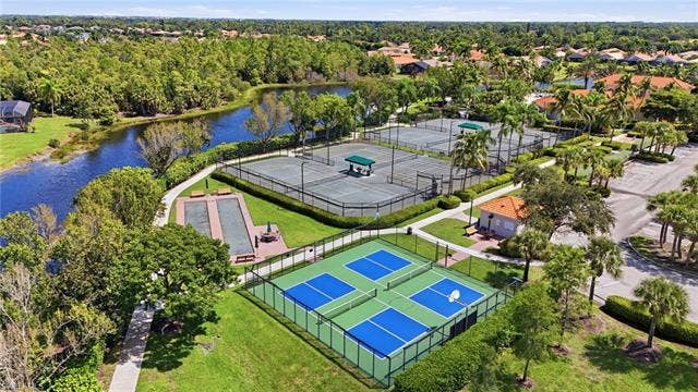 19600 Maddelena Cir, Estero, FL 33967 Community amenities featuring multiple tennis courts, pickleball courts, bocce ball courts, and a clubhouse