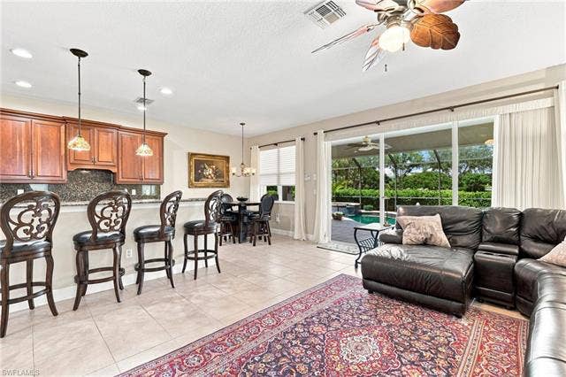 19600 Maddelena Cir, Estero, FL 33967 Open-concept living area with tile flooring throughout