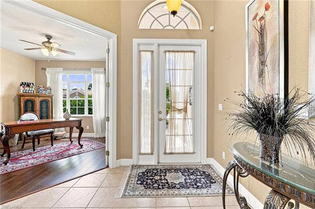19600 Maddelena Cir, Estero, FL 33967 Tiled entryway with an arched transom window and double doors