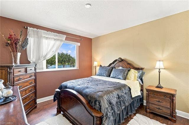 19600 Maddelena Cir, Estero, FL 33967 Wood-finish flooring with white trim