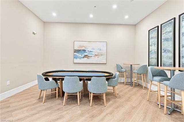 19600 Maddelena Cir, Estero, FL 33967 Recessed ceiling lighting, light wood-finish flooring, and neutral wall paint create a bright interior