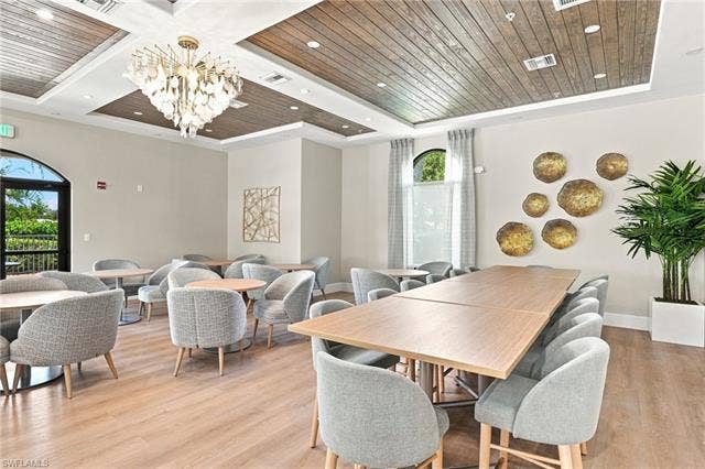 19600 Maddelena Cir, Estero, FL 33967 Wood-finish flooring with a decorative wood panel ceiling and recessed lighting