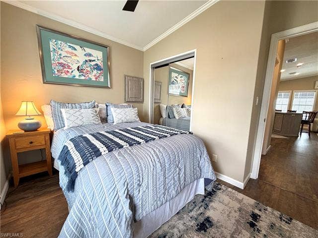 4710 W Lafayette Ln, Estero, FL 33928 Wood-finish flooring with crown molding, mirrored closet doors, and recessed lighting