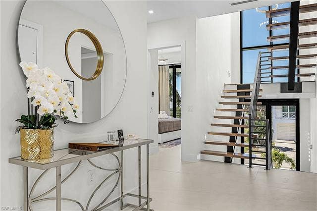 455 Palermo Cir, Fort Myers Beach, FL 33931 Hallway with stairway - Virtually Edited Image