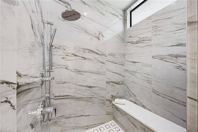 455 Palermo Cir, Fort Myers Beach, FL 33931 Bathroom with a marble finish shower - Virtually Edited Image