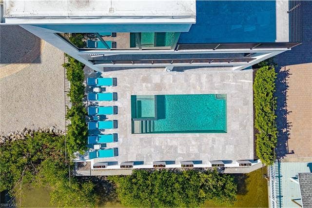 455 Palermo Cir, Fort Myers Beach, FL 33931 Aerial view of a pool area - Virtually Edited Image