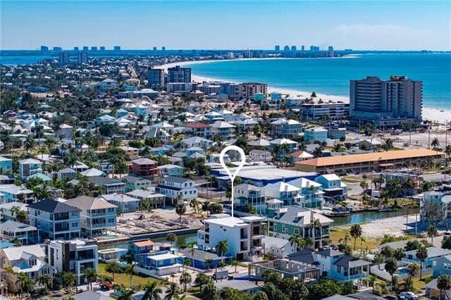 455 Palermo Cir, Fort Myers Beach, FL 33931 Drone / aerial view of city skyline and a large body of water - Virtually Edited Image