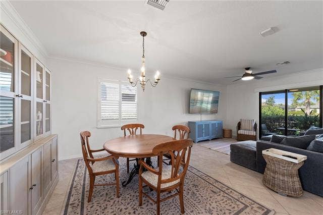 19712 The Place Blvd, Estero, FL 33928 Crown molding, a decorative chandelier, and tile flooring