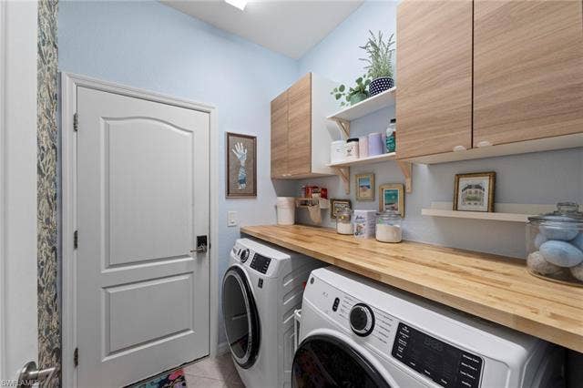 19712 The Place Blvd, Estero, FL 33928 Wood-finish cabinetry, light wood-finish countertop, and open shelving