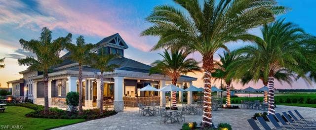 19712 The Place Blvd, Estero, FL 33928 On-site restaurant with outdoor seating and bar area.
