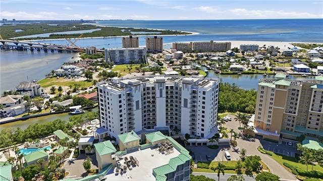 4142 Bay Beach Ln, #904, Fort Myers Beach, FL 33931 View of urban area with a nearby body of water - Virtually Edited Image