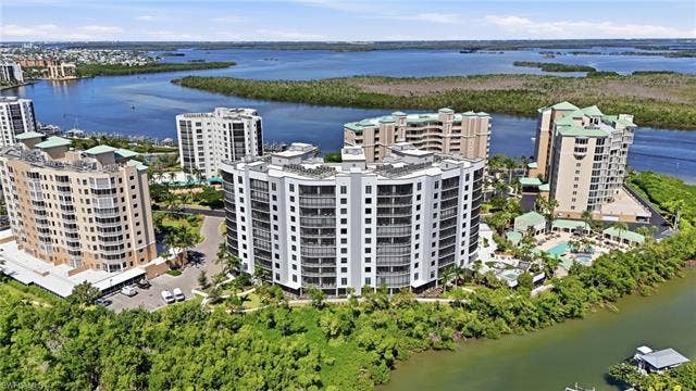 4142 Bay Beach Ln, #904, Fort Myers Beach, FL 33931 Aerial view of a large body of water - Virtually Edited Image