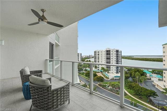 4142 Bay Beach Ln, #904, Fort Myers Beach, FL 33931 Balcony with ceiling fan - Virtually Edited Image