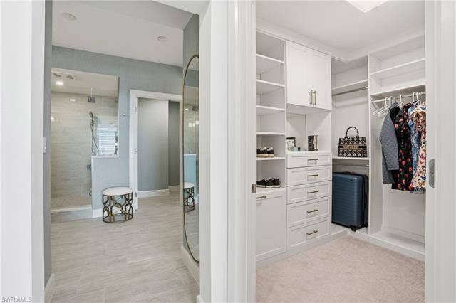 4142 Bay Beach Ln, #904, Fort Myers Beach, FL 33931 View of spacious closet - Virtually Edited Image