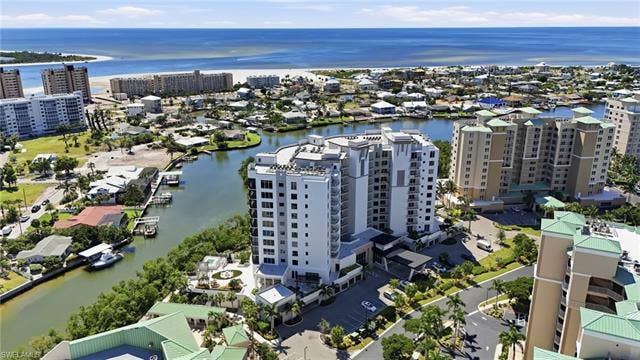 4142 Bay Beach Ln, #904, Fort Myers Beach, FL 33931 Aerial view of a large body of water - Virtually Edited Image