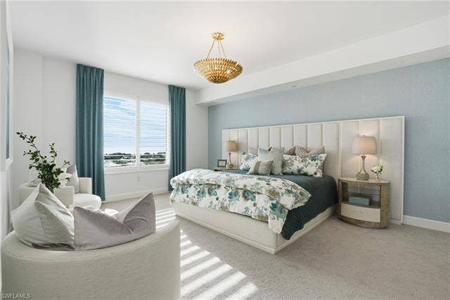 4142 Bay Beach Ln, #904, Fort Myers Beach, FL 33931 Bedroom featuring carpet flooring and baseboards - Virtually Edited Image
