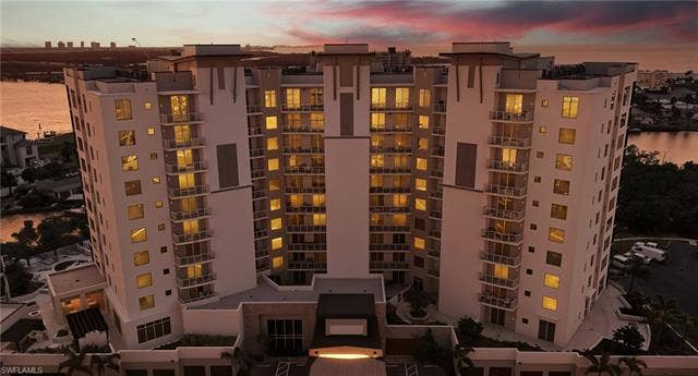 4142 Bay Beach Ln, #904, Fort Myers Beach, FL 33931 View of apartment building / complex featuring a water view - Virtually Edited Image