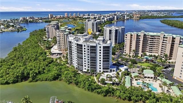 4142 Bay Beach Ln, #904, Fort Myers Beach, FL 33931 View of urban area with a large body of water - Virtually Edited Image