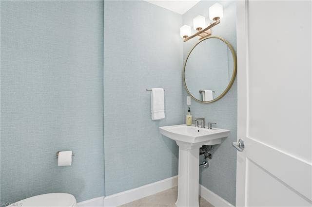 4142 Bay Beach Ln, #904, Fort Myers Beach, FL 33931 Half bath with toilet - Virtually Edited Image