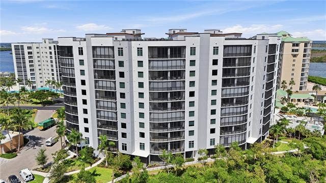 4142 Bay Beach Ln, #904, Fort Myers Beach, FL 33931 View of apartment building / complex featuring a water view - Virtually Edited Image