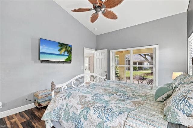 20052 Serene Meadow Ln, Estero, FL 33928 Vaulted ceiling with a ceiling fan, wall-mounted television, wood-finish flooring, and a window with blinds