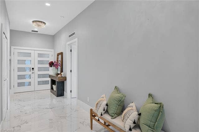 61 Mango St, Fort Myers Beach, FL 33931 Large entry hallway-Virtually Edited Image