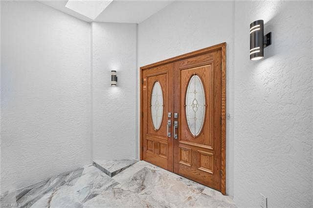 61 Mango St, Fort Myers Beach, FL 33931 Double entry doors with leaded glass inserts - Virtually Edited Image