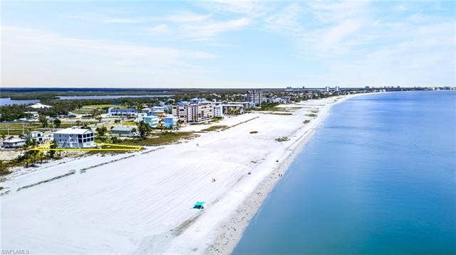 61 Mango St, Fort Myers Beach, FL 33931 Property with direct beach frontage and expansive water - Virtually Edited Image