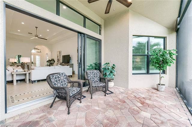 23472 Sanabria Loop, Bonita Springs, FL 34135 Triple, impact-resistant sliders let you bring the outdoors in!
