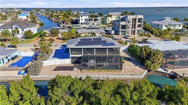 48 Fairview Blvd, Fort Myers Beach, FL 33931 Bird's eye view of a large body of water - Virtually Edited Image
