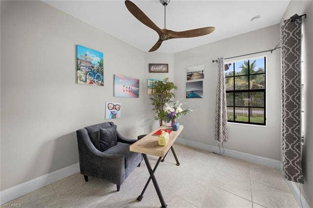 9796 Strike Ln, Bonita Springs, FL 34135 Neutral-toned walls complement the tiled flooring, featuring a large window with gridded panes