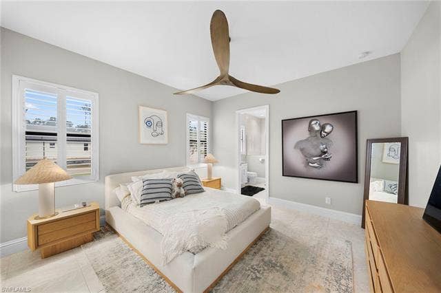 9796 Strike Ln, Bonita Springs, FL 34135 Recessed lighting and a ceiling fan with wood-finish blades